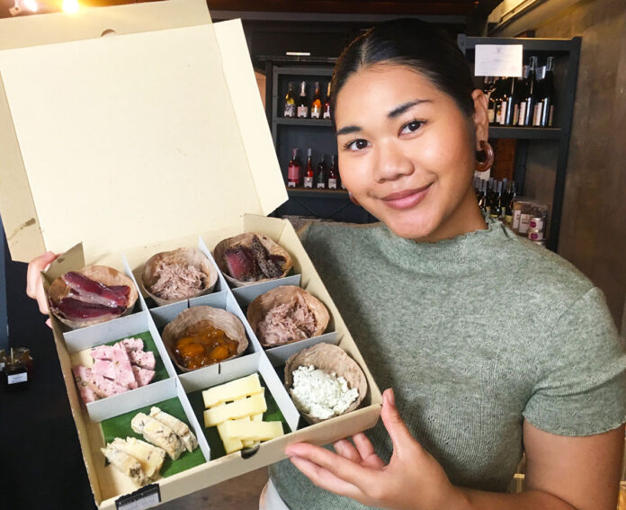 A Vivin Maison employee holds an Apero Box (890 baht).