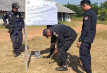 Parina Given Deadline To Hand Over Poultry Farm Forest officials put up sign announcing the confiscation of a 46-rai (7.36 hectare) portion of the farm on Nov. 5, 2019.