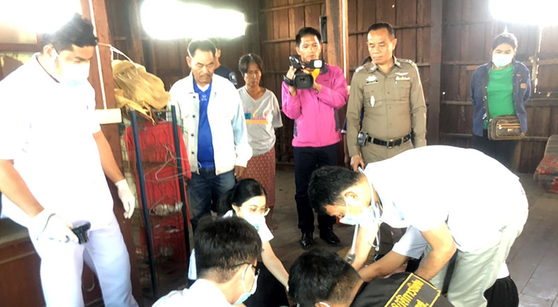 Police and autopsy officials examine Juy Kulsri, who died Dec. 3, 2019 at his home. 