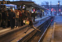 French Trains Stop as Mass Strike Begins Over Pensions In this Tuesday, April 3, 2018 file photo a passenger crosses railroad tracks at rush hour at Gare de Lyon train station, in Paris. France's rail operator SNCF and the Paris Metro say nationwide strikes will wipe out most services Thursday, impacting millions. The SNCF expects that 9 out of 10 high-speed trains won't run and that half of the Eurostar services linking France and Britain will be canceled, too. Photo: Francois Mori, File / AP