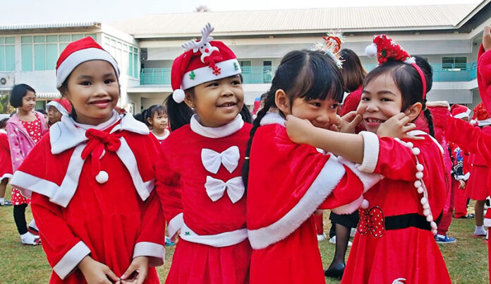 Students dress up in Santa costumes on Dec. 25, 2019 at Piyamit Wittaya School in Phayao.