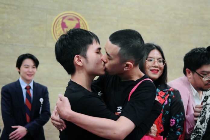 Two activists share a kiss at the Parliament on Dec. 18, 2019, after petitioning the lawmakers to legalize gay marriage and promote LGBT rights.