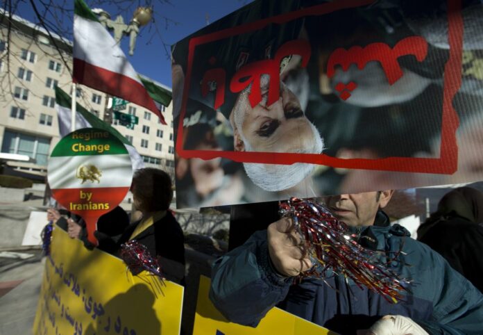 Members of the Iranian American community of Washington, D.C., who support the Mujahedeen-e-Khalq, or the MeK, an Iranian exile group that seeks to overthrow Iran’s government, rally outside the State Department in Washington, Monday, Jan. 6, 2020. Participants at the rally celebrated the death of Iranian Gen. Qassem Soleimani, who was killed by a U.S. airstrike in Iraq. (AP Photo/Jose Luis Magana)