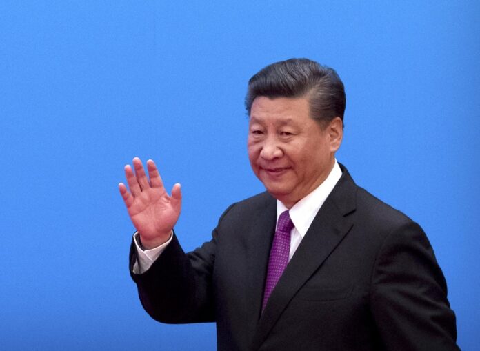 In this April 27, 2019, file photo, Chinese President Xi Jinping waves as he arrives for a press conference at the closing of the Belt and Road Forum at Yanqi Lake on the outskirts of Beijing. (AP Photo/Mark Schiefelbein, File)