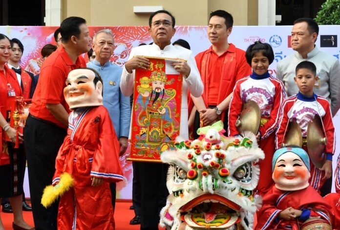 Holding an image depicting Chinese god of wealth, PM Prayuth Chan-ocha wishes Thailand a prosperous year on the occasion of 2020 Chinese New Year at Government House in Bangkok on Jan. 14, 2020.