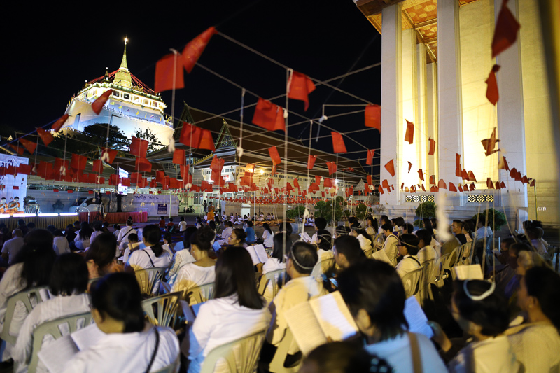 Devotees gather at Wat Saket to chant prayers on the night of Dec. 31, 2019.