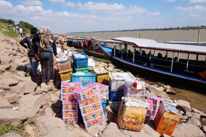 Goods are sold at a market close to Thai-Laotian borders on Mekong River in Nakhon Phanom province on Jan. 1, 2018.