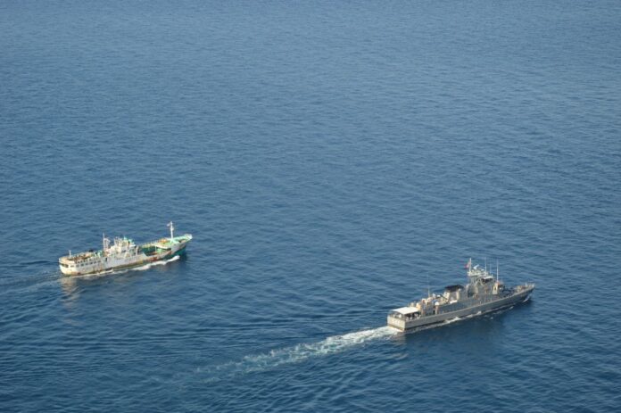 Ships sail in the Andaman Sea on Jan. 30, 2016.