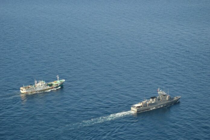 Ships sail in the Andaman Sea on Jan. 30, 2016.