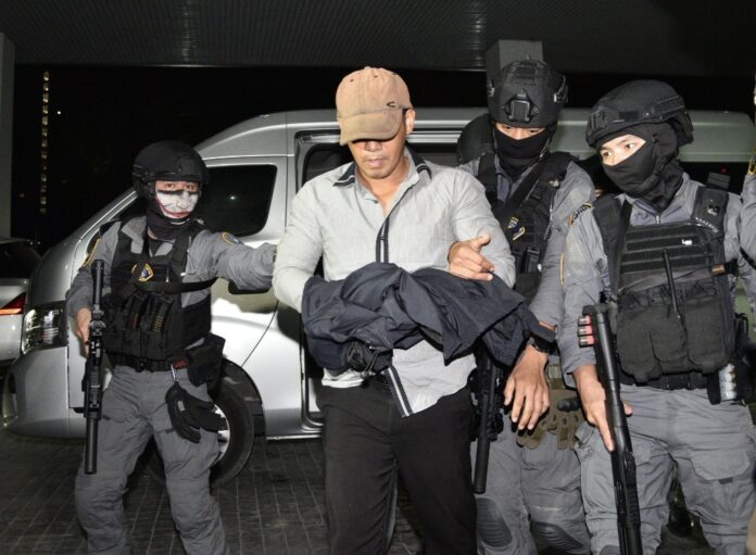 Prasittichai Khaokaew is brought to the Crime Suppression Division on the night of Jan. 22, 2020.
