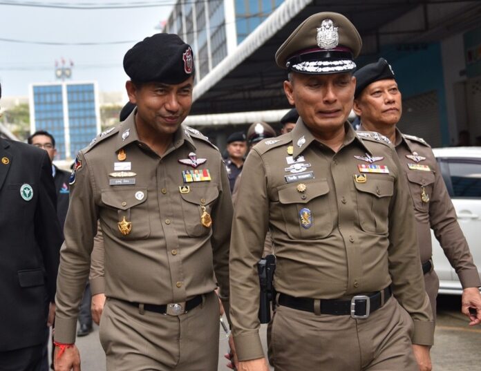 A file photo of deputy police commissioner Wirachai Songmetta, left, and immigration chief Surachate “Big Joke” Hakparn.