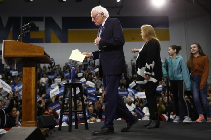 Democratic presidential candidate Sen. Bernie Sanders, I-Vt., arrives to speak to supporters at a primary night election rally in Manchester, N.H., Tuesday, Feb. 11, 2020. (AP Photo/Matt Rourke)