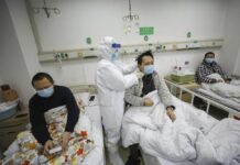 China Reports Spike in Virus Cases With New Way of Counting