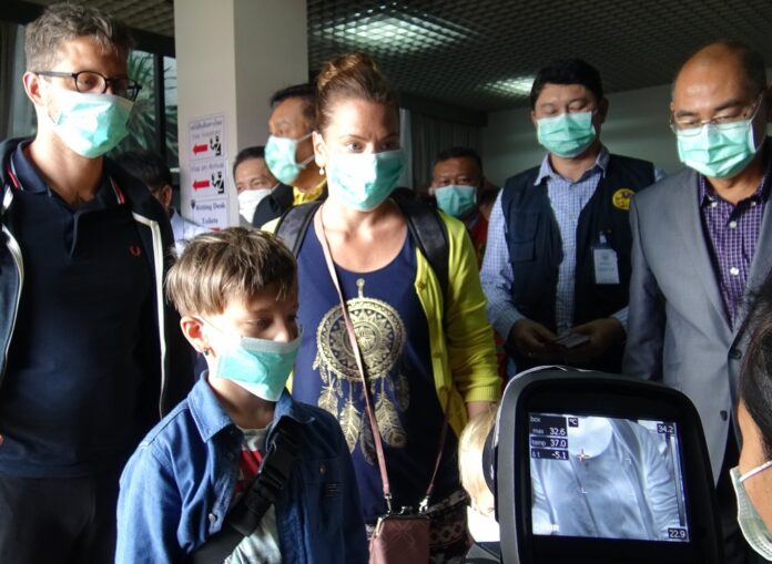 Foreign travelers are screened by a thermoscan at an airport in Hua Hin, Prachuap Khiri Khan province, on Jan. 30, 2020.