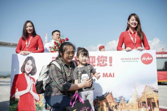 Chinese tourists are welcomed upon arriving in Chiang Mai province on Dec. 2, 2018.