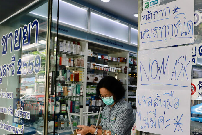A sign posted in front of a drug store near Siriraj Hospital telling customers that face masks and hand sanitizers are sold out on Feb. 5, 2020.