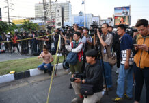 Gov’t Eyes Plan for State Media to Take Over Coverage in National Crisis A crowd of journalists take position behind the police line near Terminal 21 Korat mall on Feb. 9, 2020.