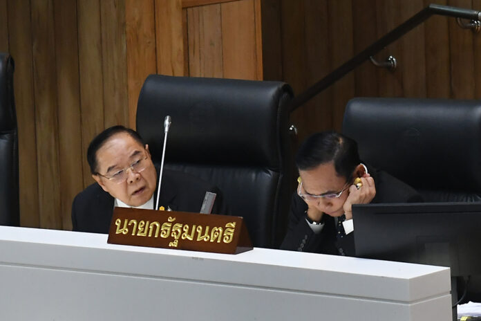 Deputy PM Prawit Wongsuwan, left, and PM Prayut Chan-o-cha, right, during a censure debate on Feb. 27, 2020. Deputy PM Prawit Wongsuwan, left, and PM Prayut Chan-o-cha, right, during a censure debate on Feb. 27, 2020.