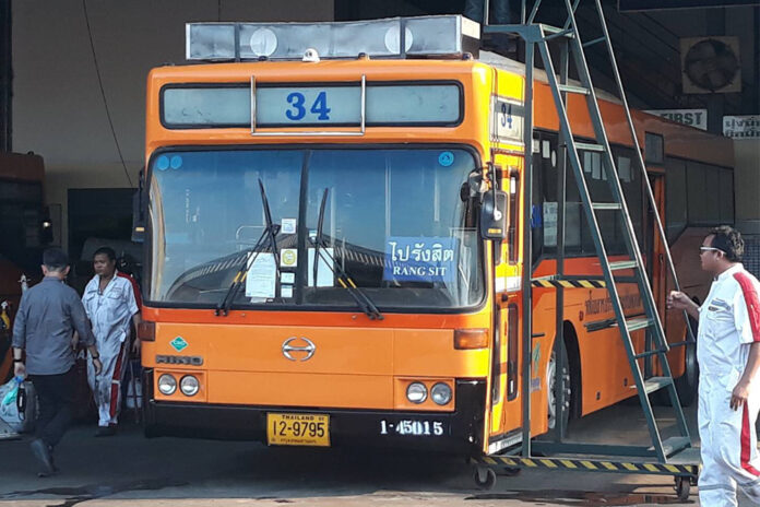 A bus fitted with an air-filtration system on top of its roof.