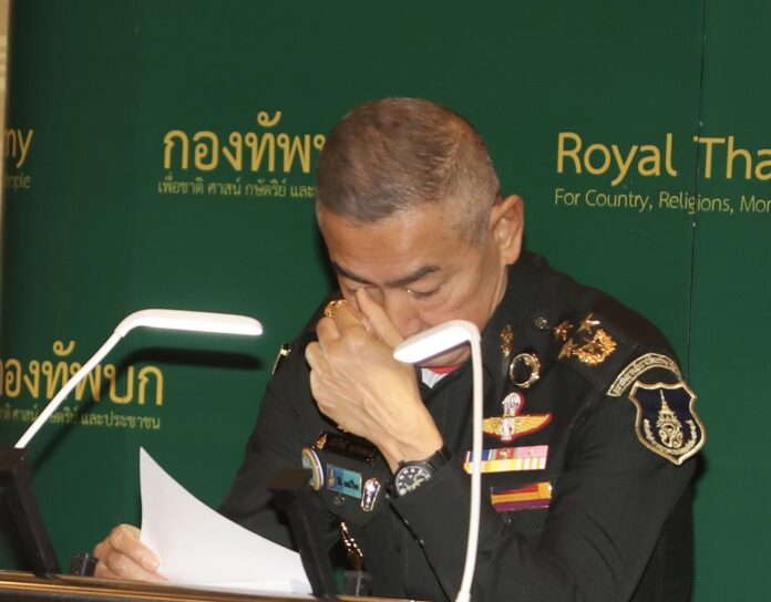 Army chief Gen. Apirat Komsompong sheds tear during a news conference on Feb. 11, 2020.