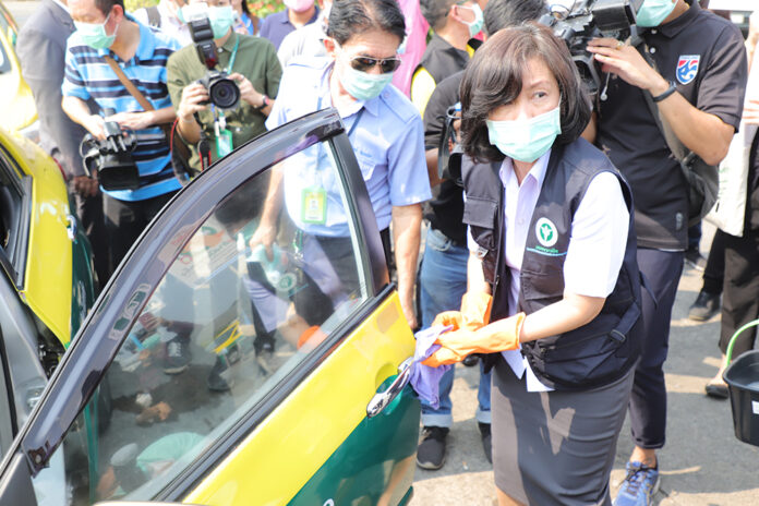 Don Mueang Airport taxis are disinfected on Feb. 4, 2020. Two of Thailand's coronavirus patients are taxi drivers.