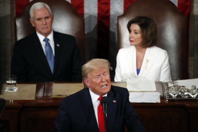 President Donald Trump delivers his State of the Union address to a joint session of Congress on Capitol Hill in Washington, Tuesday, Feb. 4, 2020, as. Vice President Mike Pence and House Speaker Nancy Pelosi of Calif., listen. (AP Photo/Alex Brandon)