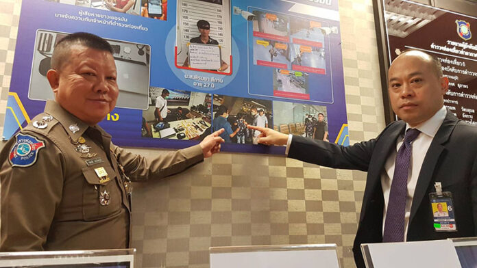 Tourist police on March 16, 2020 point to photos of Piromya Sithan’s arrest.