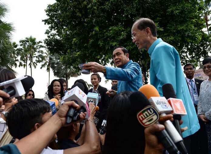 Matichon file photo of reporters interviewing PM Prayut Chan-o-cha.