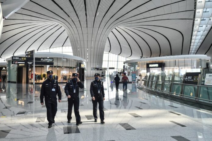 Police patrol the Daxing International Airport in Beijing, capital of China, Feb. 1, 2020. (Photo by Peng Ziyang/Xinhua)