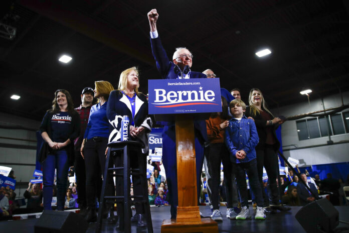 Democratic presidential candidate Sen. Bernie Sanders, I-Vt., accompanied by his wife Jane O'Meara Sanders and other family members, speaks during a primary night election rally in Essex Junction, Vt., Tuesday, March 3, 2020. Photo: Matt Rourke / AP