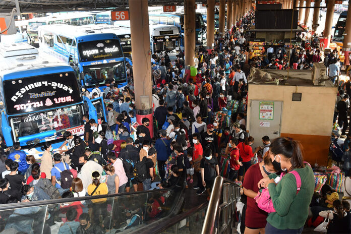 Mo Chit Bus Terminal crowded with people taking buses back to their hometowns on March 22, 2020.
