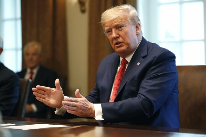 President Donald Trump speaks during a meeting with supply chain distributors in the Cabinet Room of the White House, Sunday, March 29, 2020, in Washington. (AP Photo/Patrick Semansky)