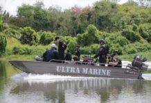 Soldier Killed in Week-Long Siege at Deep South Dam A Muslim cleric on a boat with security forces on March 17, 2020.