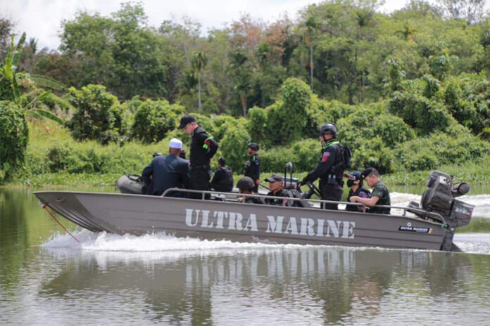 A Muslim cleric on a boat with security forces on March 17, 2020.