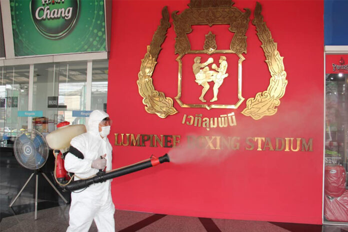A worker disinfects Lumpinee Boxing Stadium on March 5, 2020. Photo: Lumpinee Boxing Stadium / Facebook A worker disinfects Lumpinee Boxing Stadium on March 5, 2020. Photo: Lumpinee Boxing Stadium / Facebook