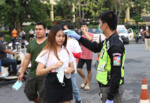Anutin: Gov’t Won’t Use Coronavirus to Ban Student Protests A student gets checked for her temperature before attending a protest at Ramkhamhaeng University on Feb. 26, 2020.