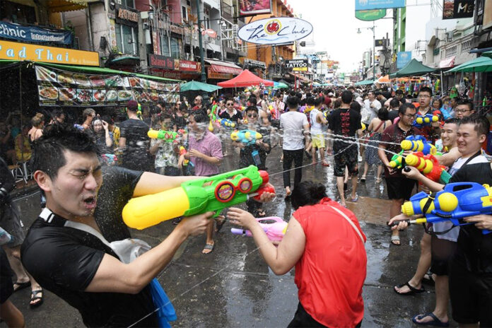 Revelers engage in a waterfight on Khaosan Road during the 2019 Songkran festival.