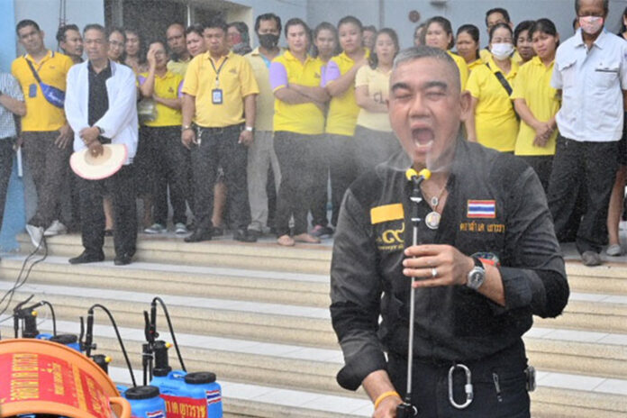 Somsak Sripetch demonstrates his disinfectant spray to the media on March 12, 2020. Somsak Sripetch demonstrates his disinfectant spray to the media on March 12, 2020.