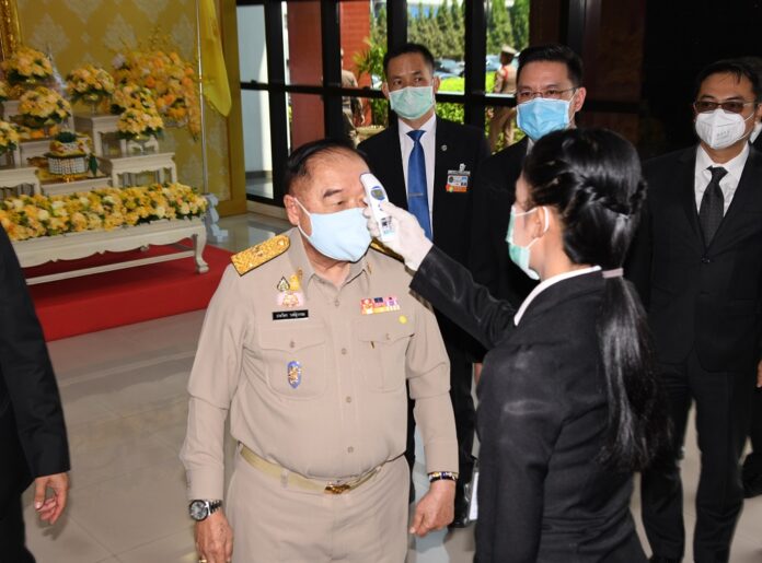Deputy PM Prawit Wongsuwan gets his temperature checked on March 31, 2020.