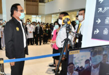 Partygoers Infected With Coronavirus, Raising Number to 75 Prime Minister Prayut Chan-o-cha gets his temperature check during his visit to Rajavithi Hospital on March 12, 2020.