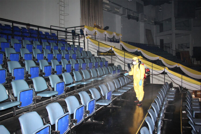 A worker disinfects Lumpinee Boxing Stadium. Photo: Lumpinee Boxing Stadium / Facebook