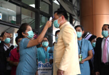 Thai Airport Staff Infected With Coronavirus as Tally Rises to 59 Health minister Anutin Charnvirakul gets his temperature check during his visit to Bamrasnaradura Infectious Diseases Institute on March 10, 2020.