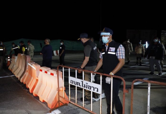 Security officers seal off roads to Phuket island in the early hours of March 30, 2020.