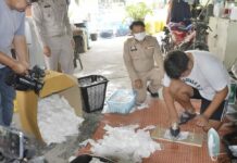 Arrested Vendor Says She Sells 200,000 Reused Masks A worker at a shop in Saraburi shows police how he and other employees allegedly wash and iron used face masks for reselling on March 3, 2020.