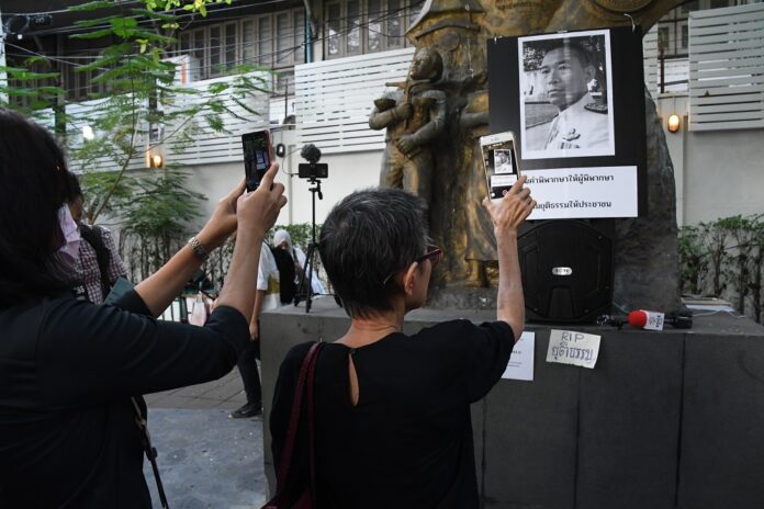 Portrait of judge Khanakorn Pianchana is displayed at a rally in Thammasat University on March 8, 2020.