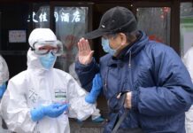 China Finds 8 New Virus Cases, Down From Peak of 15,000