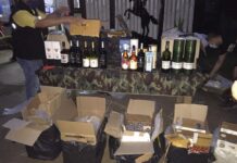 Petition Asks Gov’t to Relax Ban on Booze Sales in Pandemic Security officers show a cache of alcohol reportedly seized from smugglers on April 27, 2020.