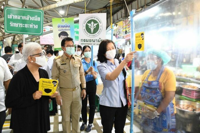 Health officials inspect a market in Bangkok on April 27, 2020.