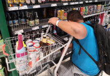 Booze Ban Extended Indefinitely to ‘Curb Coronavirus’ A man shops for alcohol at Siam Paragon on April 9, 2020.