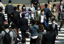 As Outbreaks Flatten in Places, Japan, India See More Cases People with protective masks cross a pedestrian walkway Thursday, April 9, 2020, in Tokyo. Japanese Prime Minister Shinzo Abe declared a state of emergency last Tuesday for Tokyo and six other prefectures to ramp up defenses against the spread of the coronavirus. Photo: Eugene Hoshiko / AP